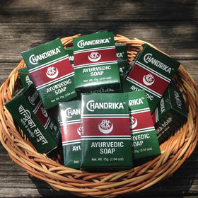 Chandrika bar closeup texture reveals smooth, herbal formula for soft, refreshed skin.