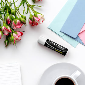 ChapStick daily-use lip balm in use for dry lips relief and base under color.