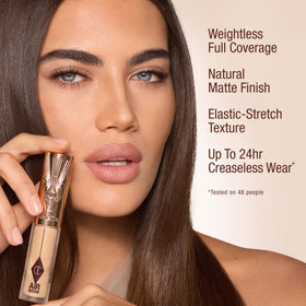 Charlotte Tilbury AIRbrush Flawless Blur Concealer with Hyaluronic Acid delivers hydrating texture.
