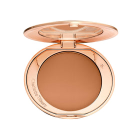 Charlotte Tilbury Airbrush Flawless Finish Powder compact close-up showing pore-blurring texture.