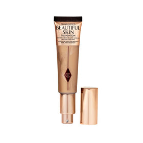 Charlotte Tilbury Beautiful Skin Foundation bottle shows dewy, hydrated finish.