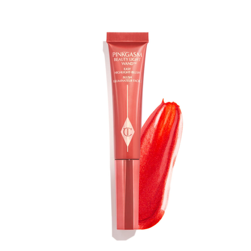 Charlotte Tilbury Beauty Light Wand Pinkgasm Sunset swatch highlighting cheek glow
