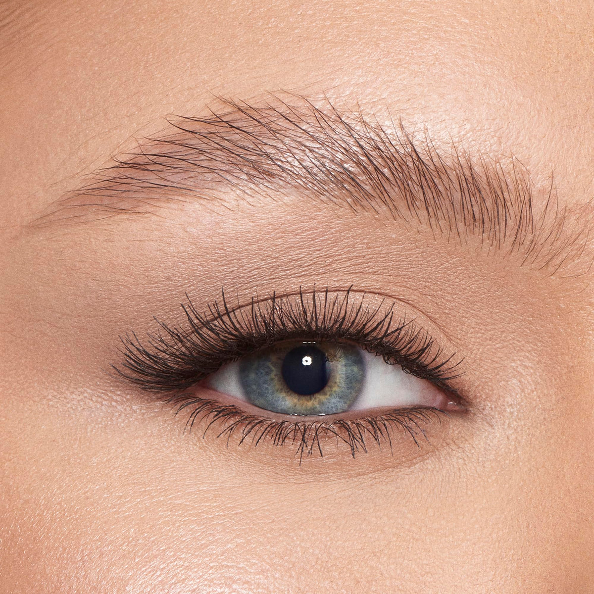 Charlotte Tilbury Brow Fix clear-hold image highlights invisible finish with no stiffness across brows.