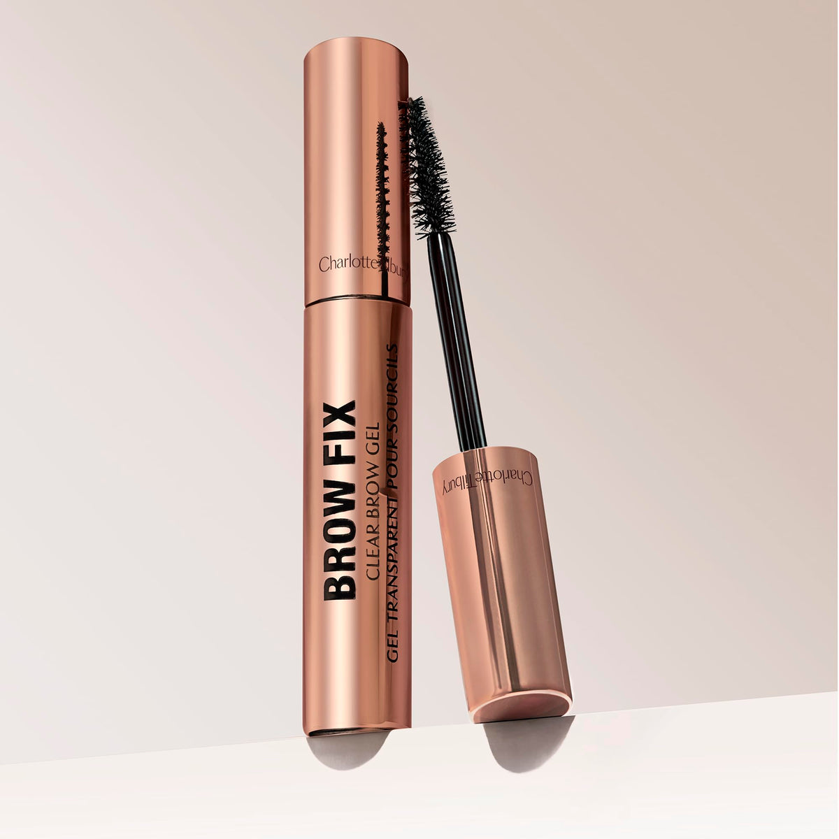 Charlotte Tilbury Brow Fix silk-thread image emphasizes shine and flexible hold.