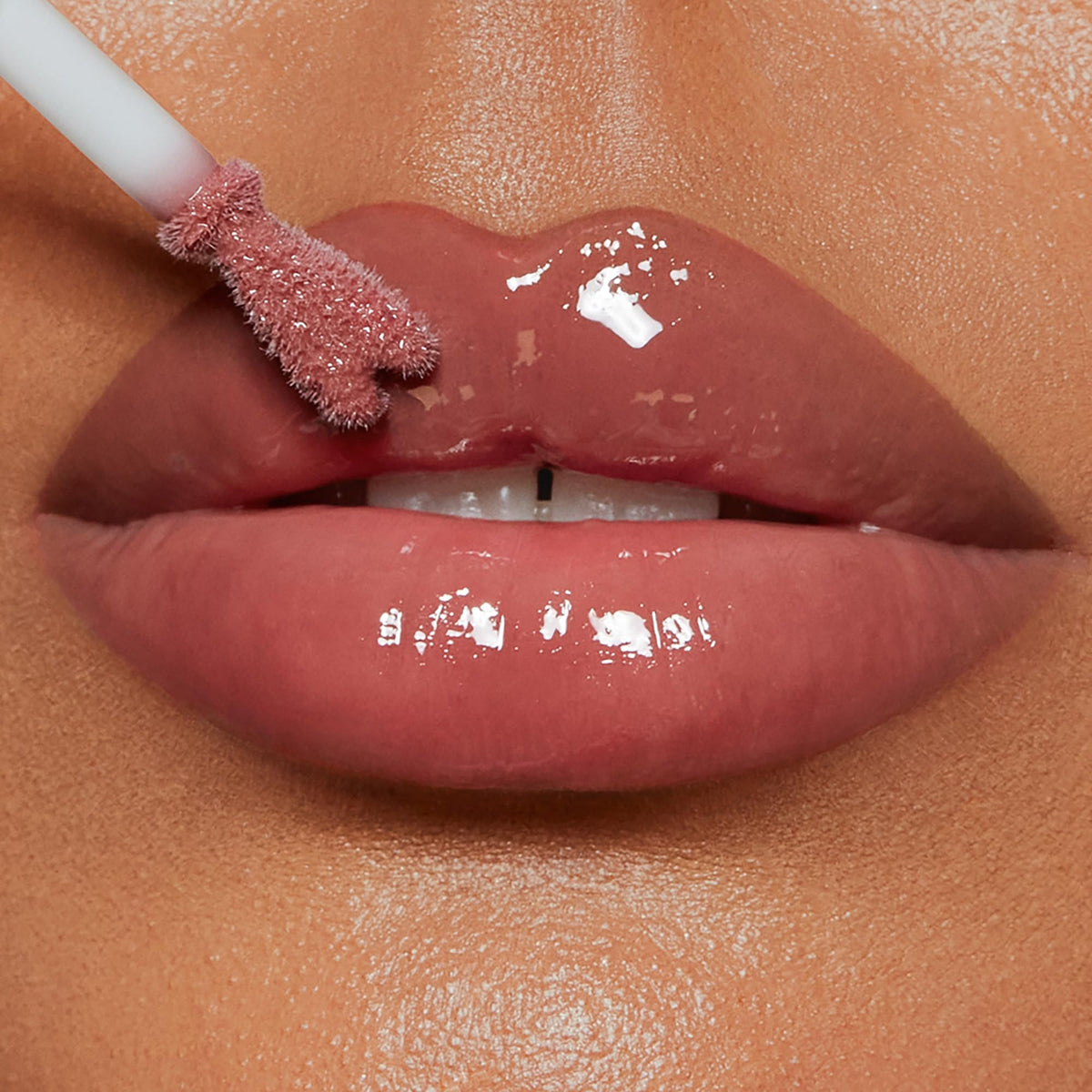 Charlotte Tilbury Collagen Lip Bath gloss close-up highlights luminous shine