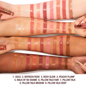 Charlotte Tilbury Collagen Lip Bath on lips for a mirror-like shine.