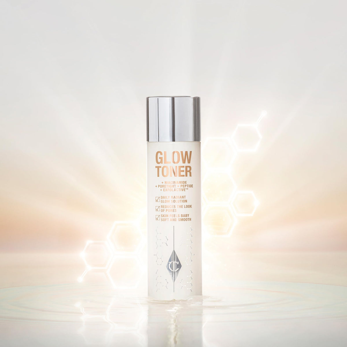 Applying Glow Toner with pad to refine pores and prep skin.