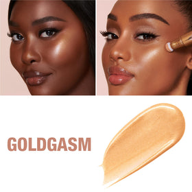 Charlotte Tilbury Glowgasm Beauty Light Wand demonstrates dotting on the cheekbone for radiant light.