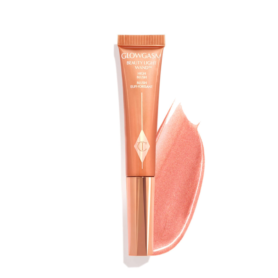 Charlotte Tilbury Glowgasm Peachgasm bottle pour showing pearlescent cheek glow