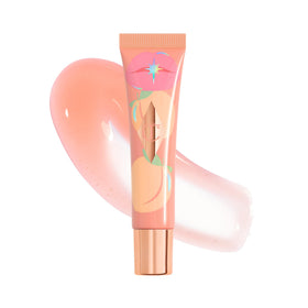 Charlotte Tilbury Healthy Glow Nectar Lip Oil cap close-up shows peach glow and shine.
