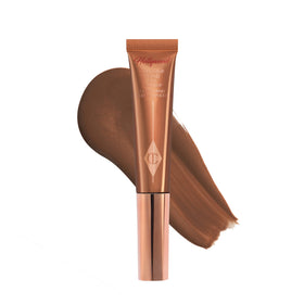 Charlotte Tilbury Hollywood Contour Wand bottle close-up showing creamy contour formula for natural sculpt.