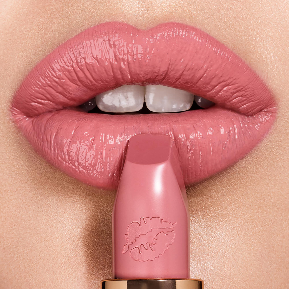 Charlotte Tilbury Hot Lips Liv It Up swatch shows buildable color on the lips.