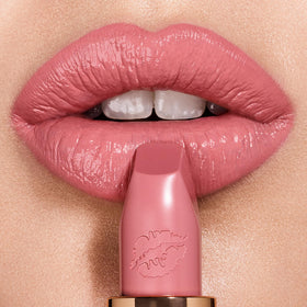 Charlotte Tilbury Hot Lips Liv It Up swatch shows buildable color on the lips.