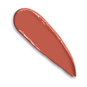 Charlotte Tilbury K.I.S.S.I.N.G Lipstick Stoned Rose swatch on arm shows peachy coral-rose shade and hydration.