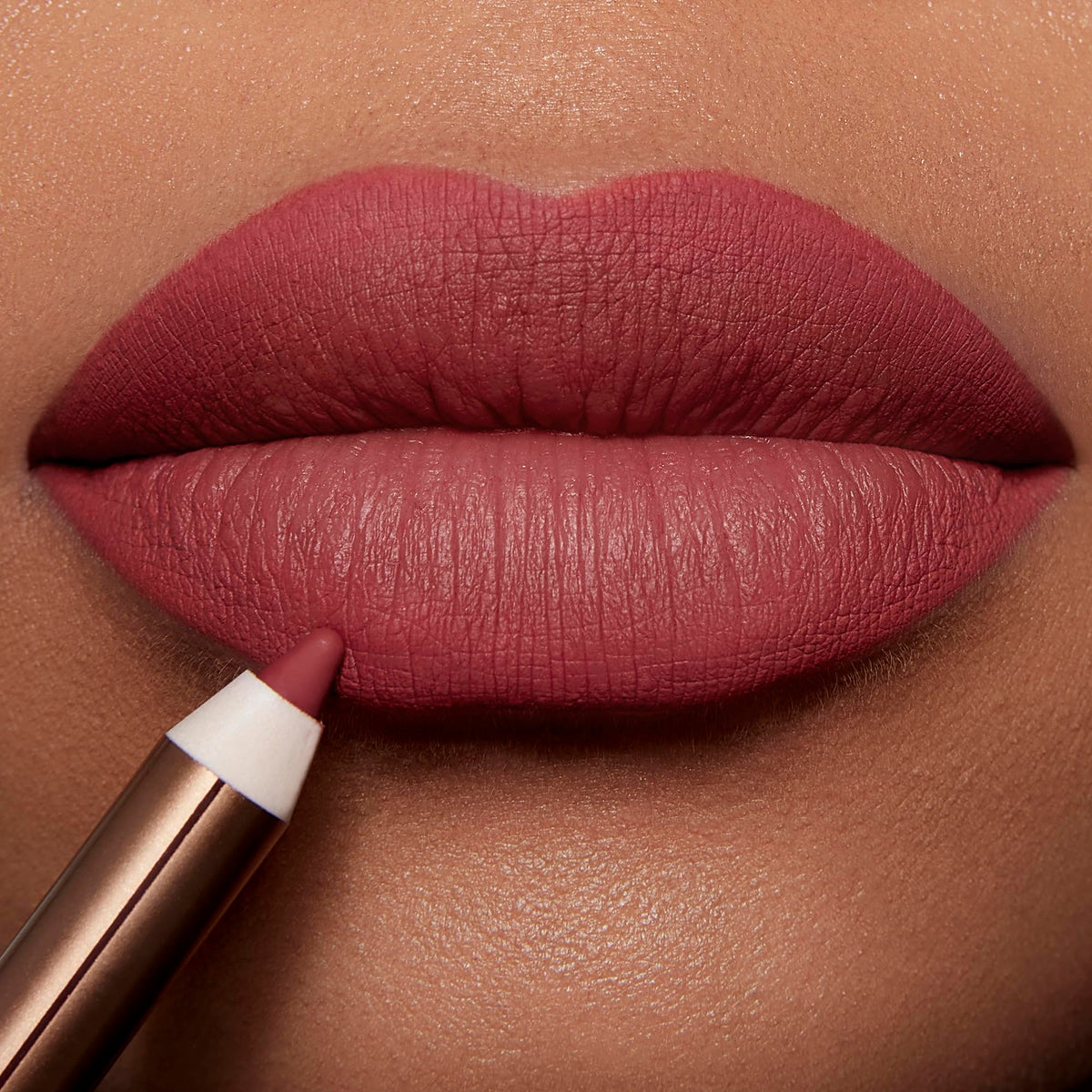Outline with Lip Cheat to reshape lips for a fuller look.