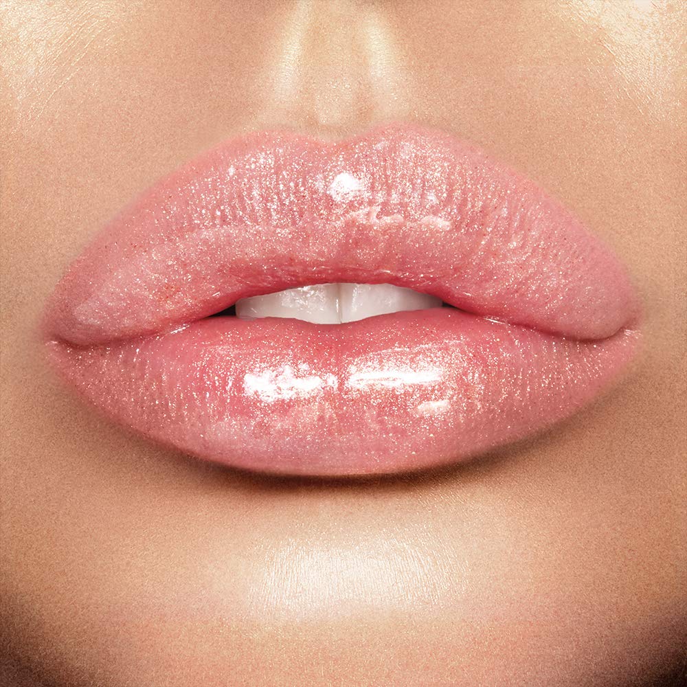 Charlotte Tilbury Lip Lustre lotus-extract conditioning close-up showing smoothing hydration.