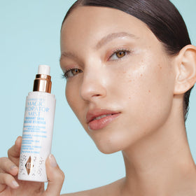Close-up of Charlotte Tilbury Magic Hydrator Mist delivering hydration for radiant skin.