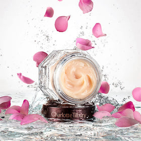 Close-up of the Magic Night Cream jar shows rich, balm-like texture.