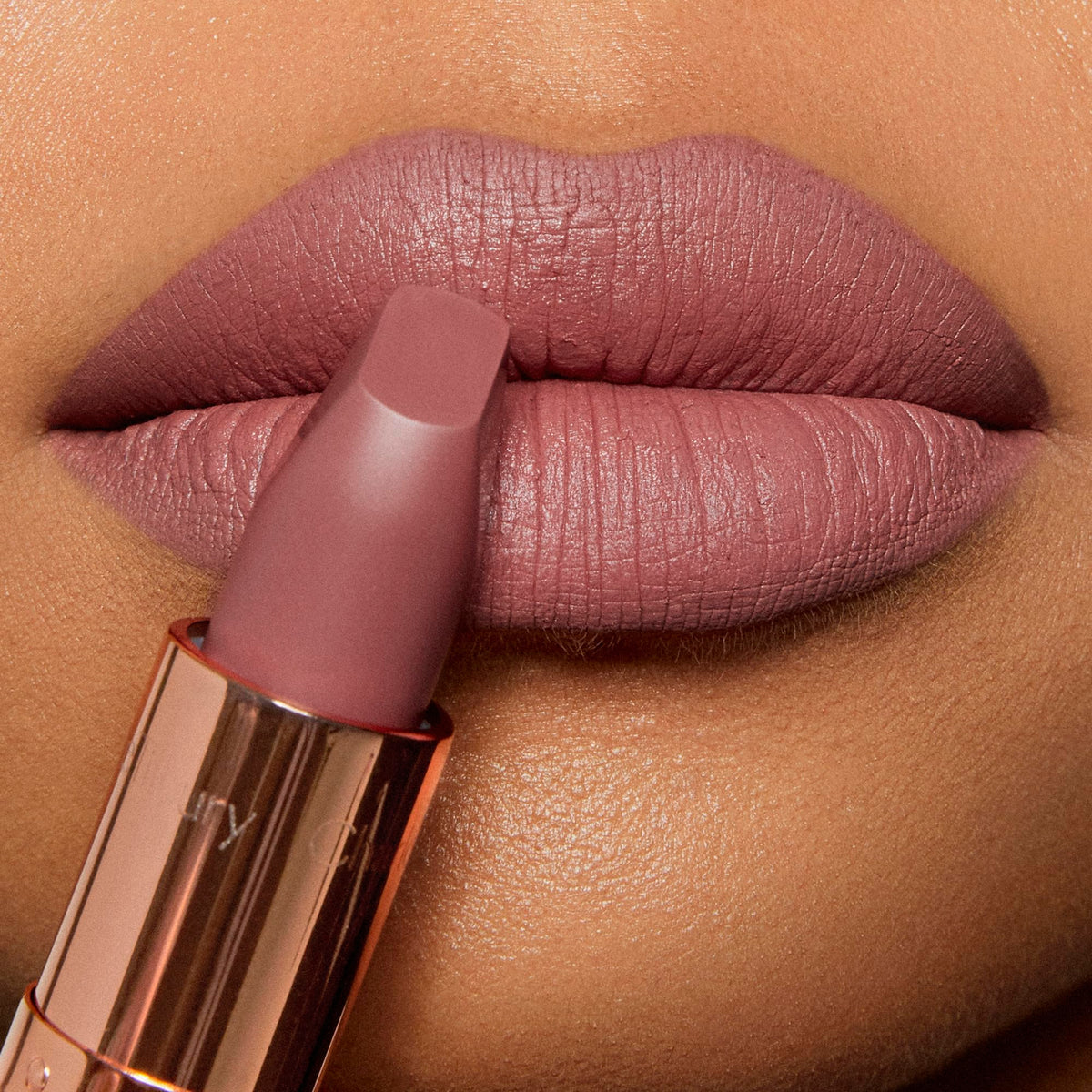 Close-up of Very Victoria lipstick texture on lips showing matte finish.