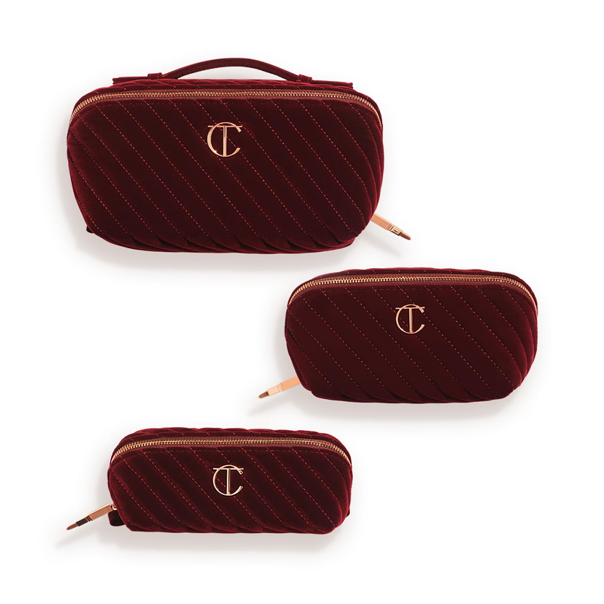 Charlotte Tilbury travel makeup bag on a vanity highlights compact size and chic night crimson vibe