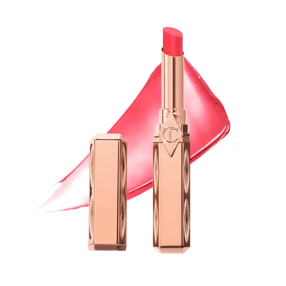 Charlotte Tilbury Pillow Talk Blush Balm Lip Tint on lips for hydrating sheer color.