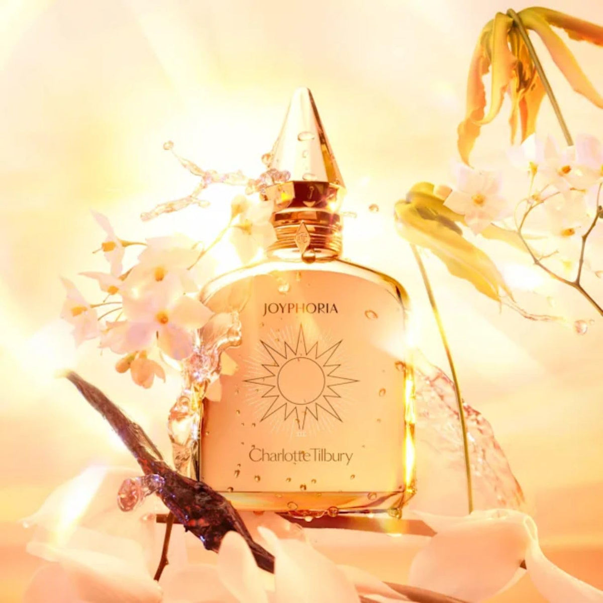 Charlotte Tilbury Star Confidence mini bottle pour for lasting aroma.