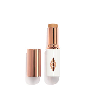 Charlotte Tilbury Unreal Skin Tint bottle demonstrates dewy, lightweight finish for everyday radiance.
