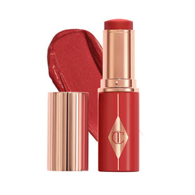 Charlotte Tilbury Unreal Healthy Glow Blush Stick delivers a juicy-sheen finish for radiant cheeks.
