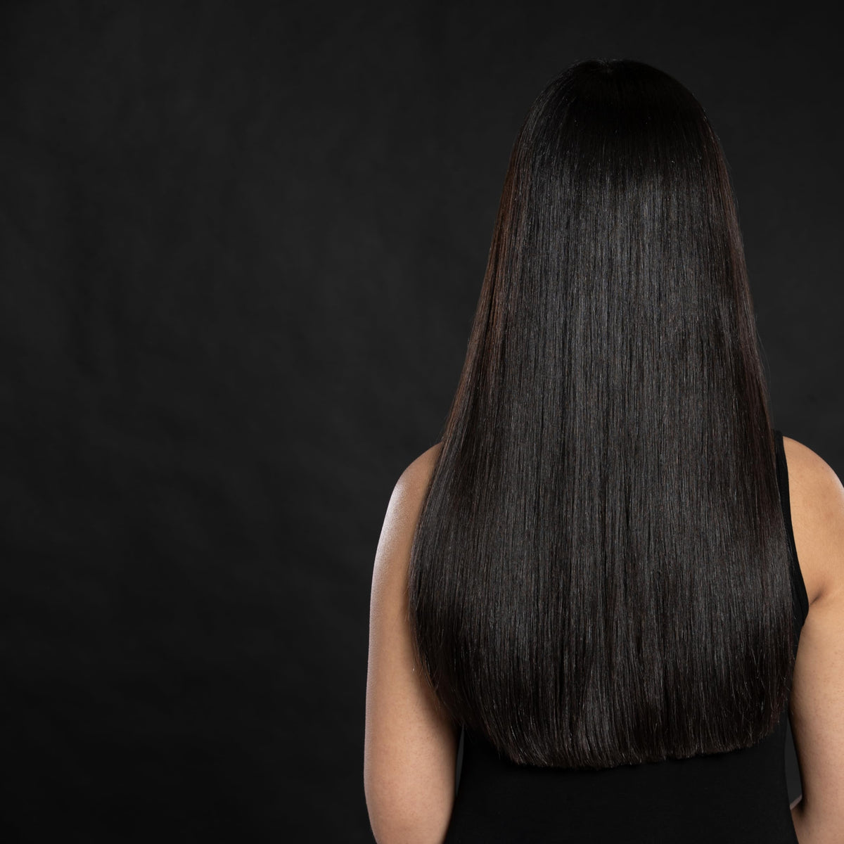 Ceramic-protein CHI hairspray bottle highlighting protective styling.