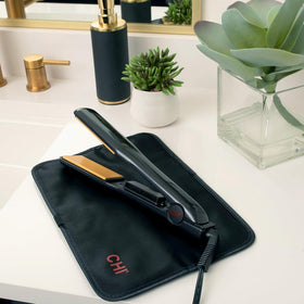 Adjustable temperature dial on CHI iron for versatile hair types.