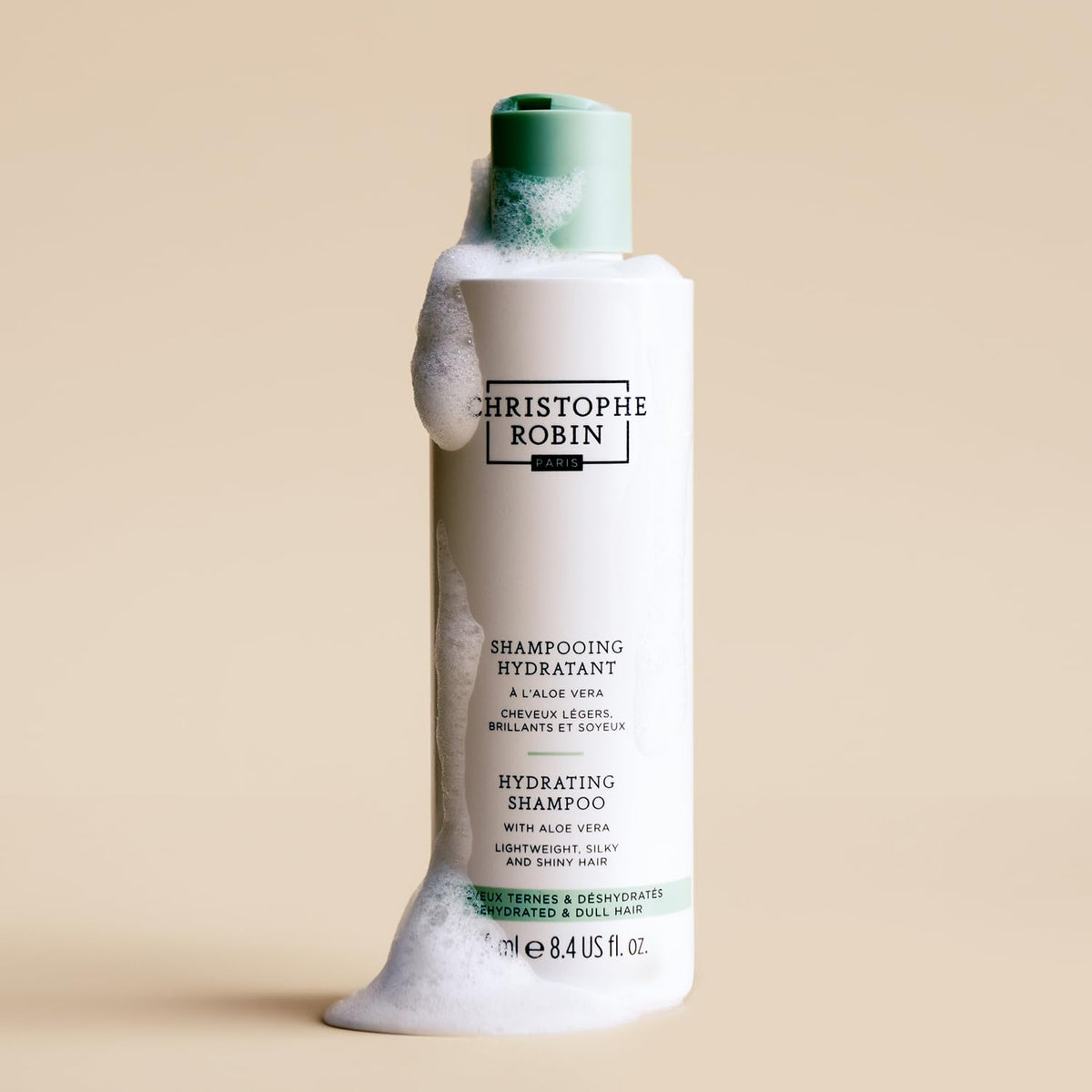 Christophe Robin shampoo creamy lather shown on hair for smooth lengths