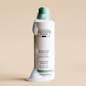 Christophe Robin shampoo creamy lather shown on hair for smooth lengths