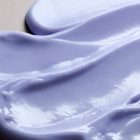 Back view of Christophe Robin Baby Blonde conditioner bottle highlighting violet pigments for color correction.