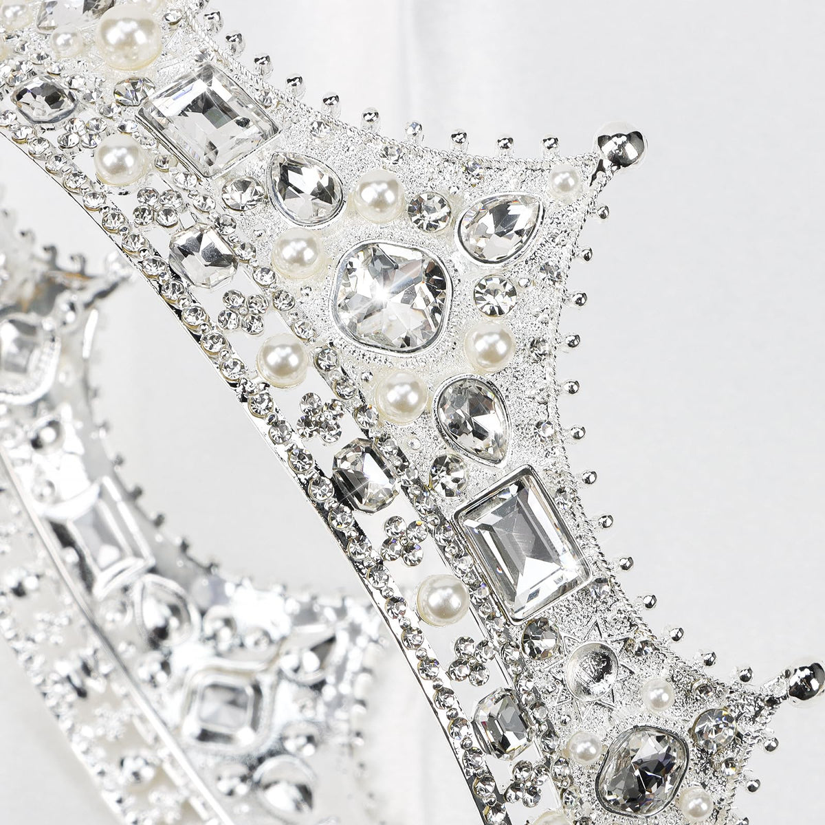 CIEHER royal crown detail highlighting baroque elements from the side.