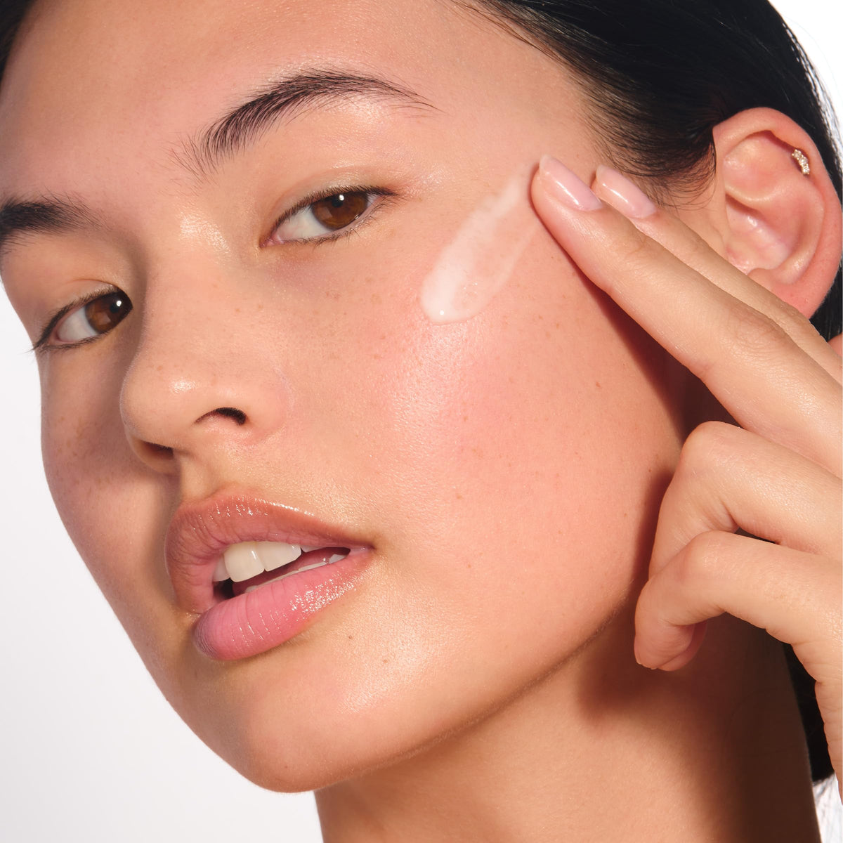 Clarins Bright Plus Serum applying in daily routine during morning use.
