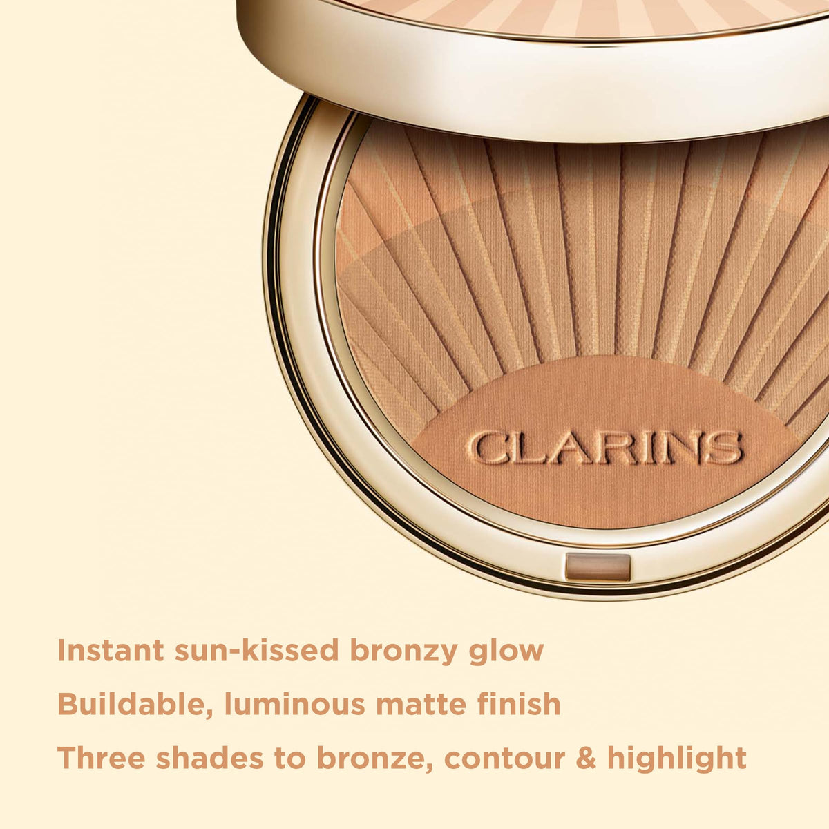 Clarins bronzing powder brush swirl demonstrating seamless blendability for a natural contour