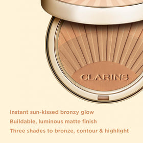 Clarins bronzing powder brush swirl demonstrating seamless blendability for a natural contour