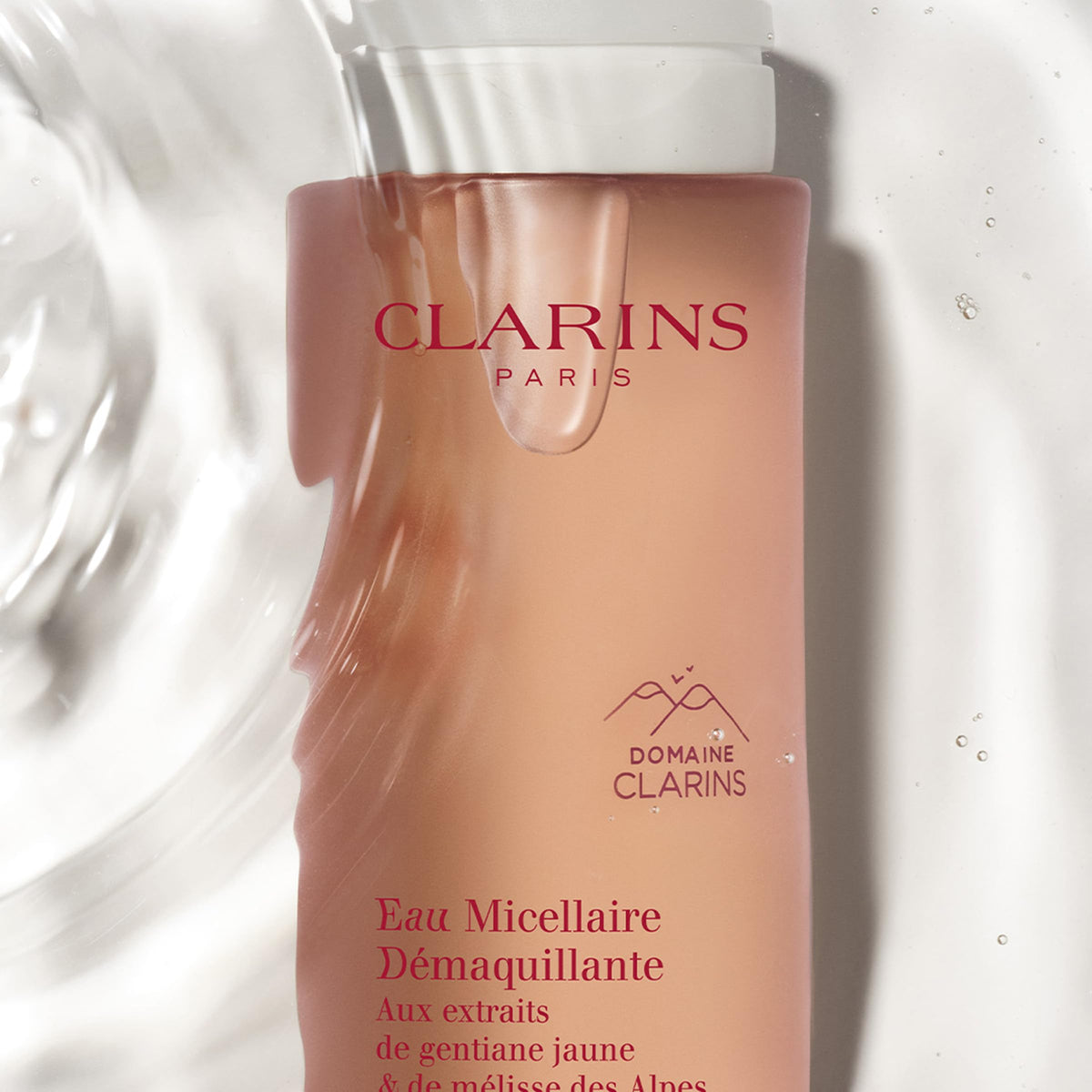 Clarins Micellar Water being applied to the face for cleansing and freshness.
