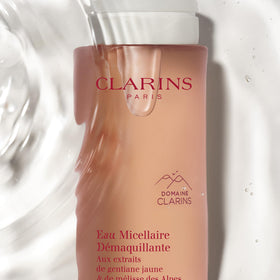 Clarins Micellar Water being applied to the face for cleansing and freshness.