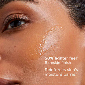 Elegant packaging of Clarins Double Serum Light Texture on a vanity