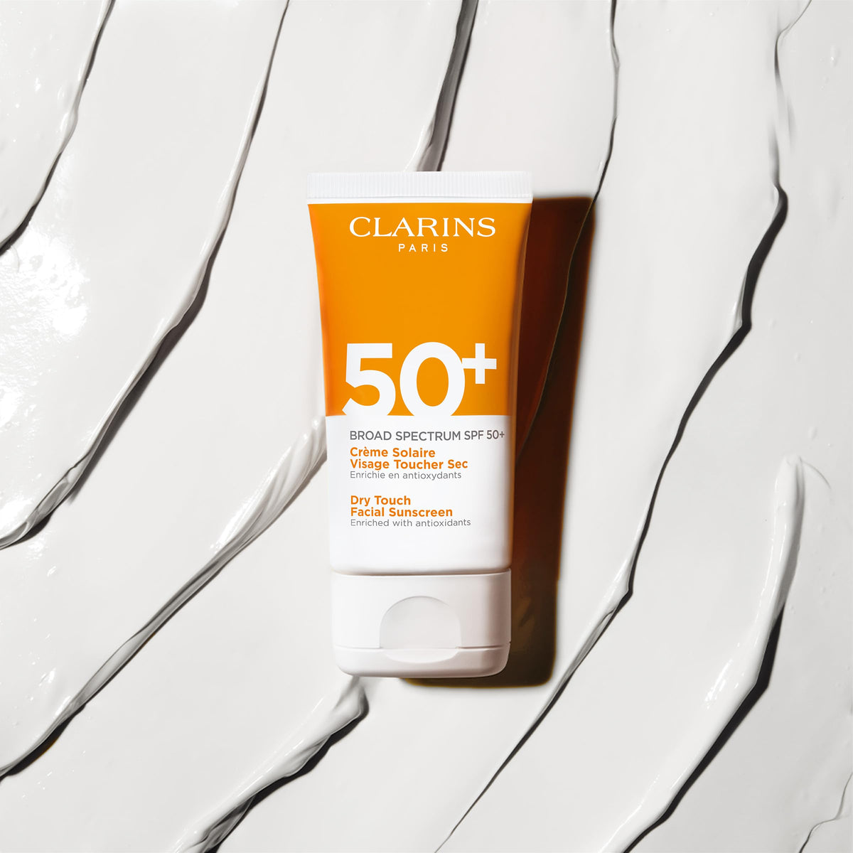 Clarins Dry Touch sunscreen finish provides matte, no white cast look.