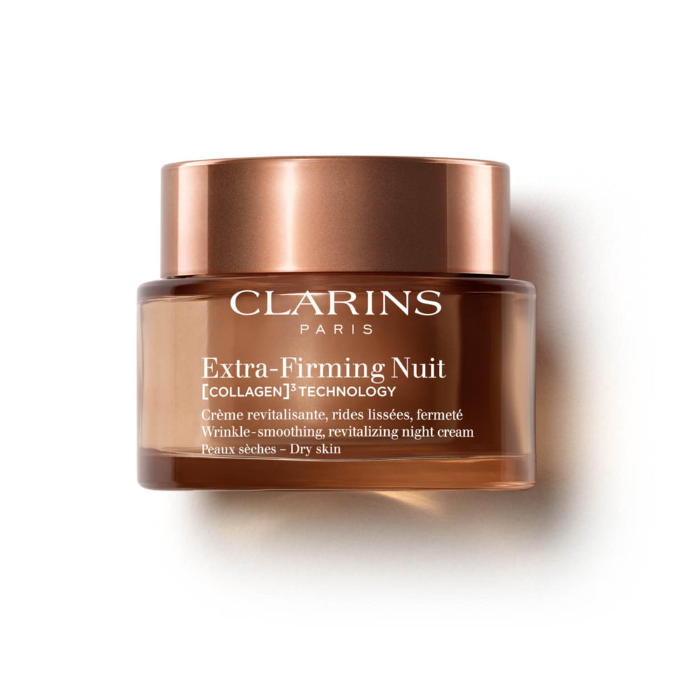 Clarins Extra-Firming night moisturizer bottle close-up highlighting premium packaging and nighttime hydration.