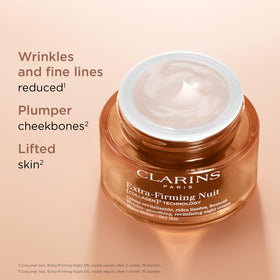 Clarins Extra-Firming night moisturizer jar open revealing creamy texture for smoother, firmer-looking skin.