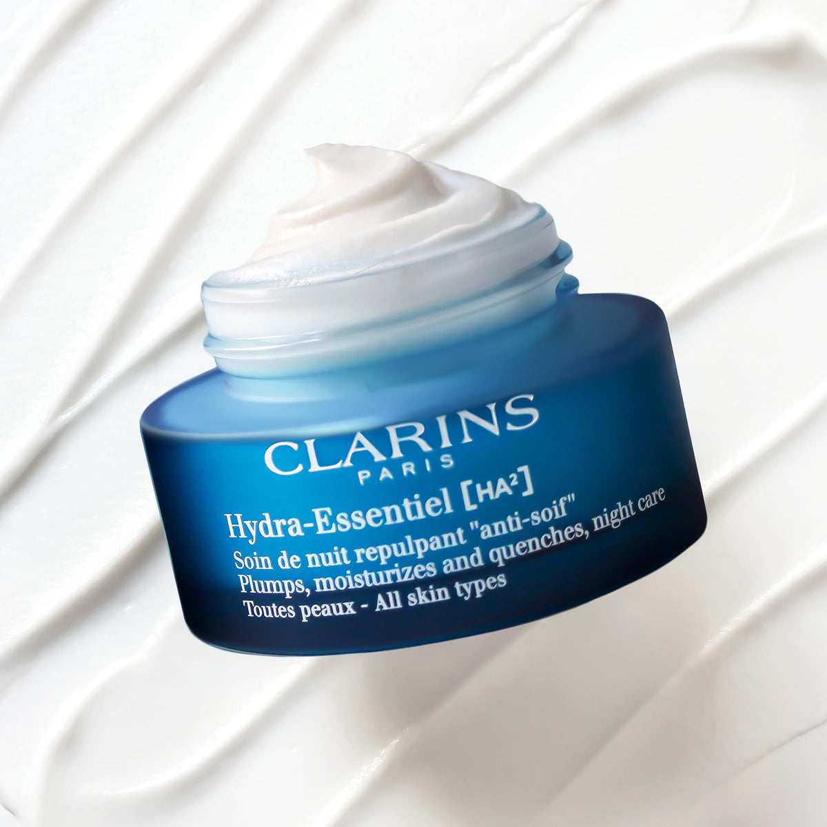 Clarins Hydra-Essentiel night-cream texture swirl showing rich hydration