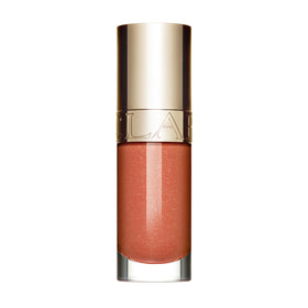 Clarins Lip Comfort Oil bottle close-up delivering glossy shine and hydration.