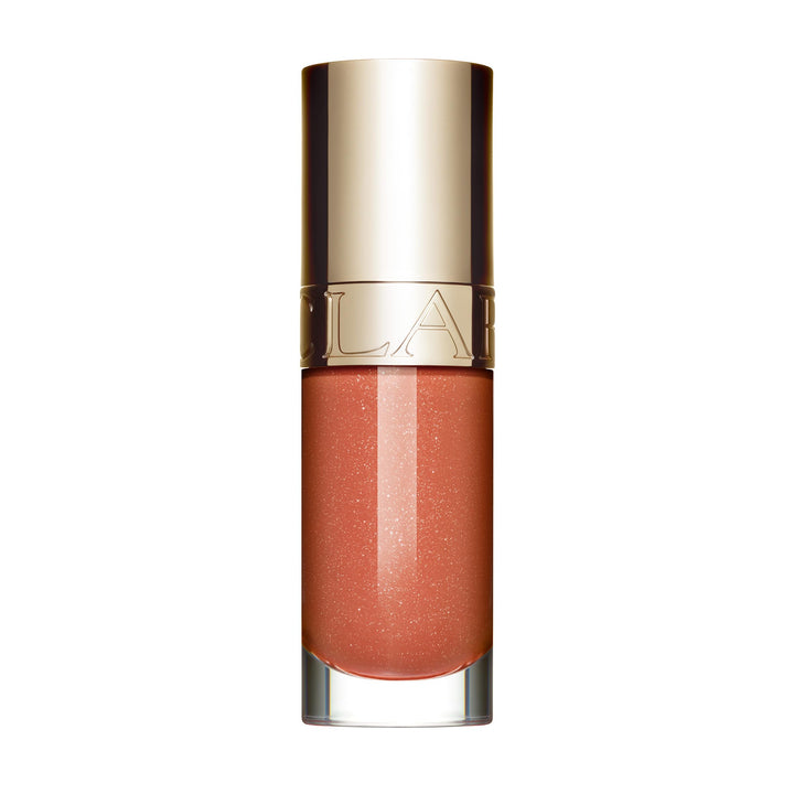 Clarins Lip Comfort Oil bottle close-up delivering glossy shine and hydration.