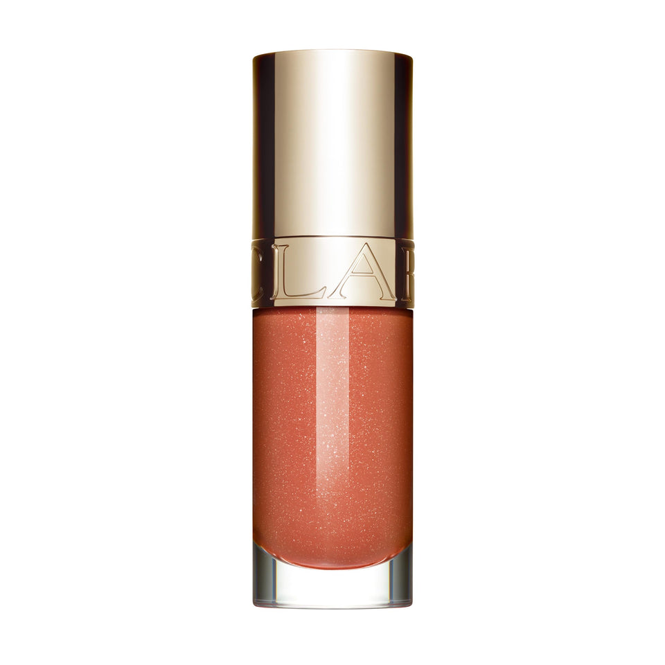 Clarins Lip Comfort Oil bottle close-up delivering glossy shine and hydration.