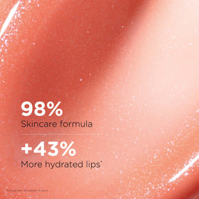 Close-up of color swirl in Clarins Lip Comfort Oil showing a hint of shade.