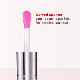 On-lip shot of Clarins Lip Comfort Oil delivering nourishing shine.