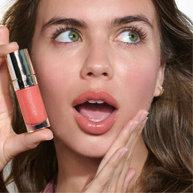 Packaging front of Clarins Lip Comfort Oil showing premium design.